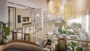 A modern interior with a mezzanine level, glass railings, and a central staircase. - Mercure Madiun (Madiun)