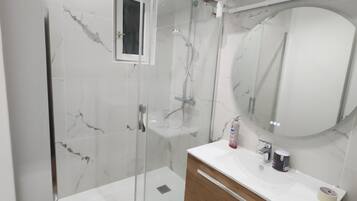 Shower, hair dryer, towels, soap