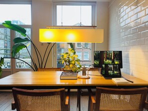 Enjoy a meal for two in this stylish dining area with a city view.