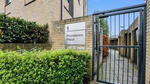 A gated entrance with a sign reading "Providence Place 1 32-45". - Hybrid Resi Greenwich (London)