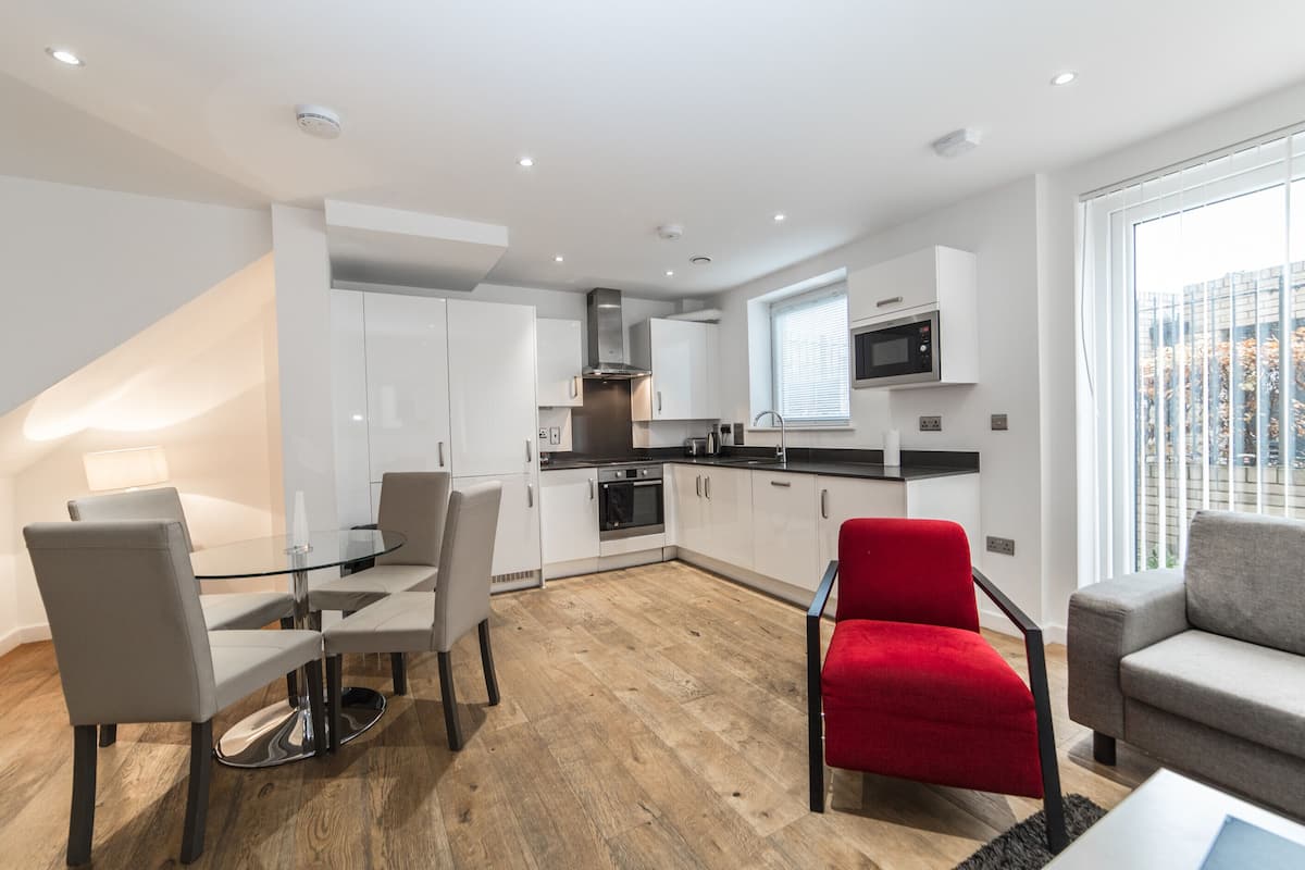 Superior Apartment, Balcony, City View | Living area | 32-cm flat-screen TV with digital channels