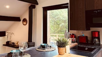 Fridge, microwave, stovetop, coffee/tea maker