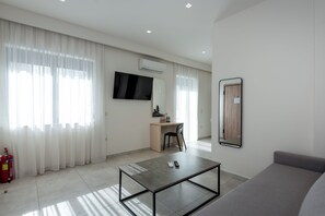 Family Apartment, Garden View | Living area | 42-inch Smart TV with cable channels, offices - Harma City Living (Chania)