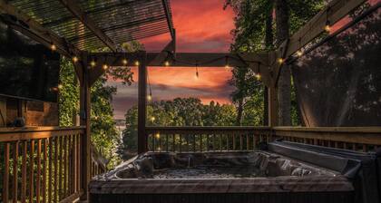 Magical lake cabin with private mini golf, hot tub + epic game room!