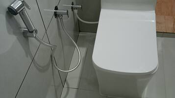 Shower, towels, soap, toilet paper