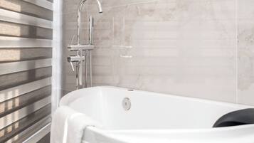 Deluxe Suite, Balcony, City View | Bathroom | Hair dryer, slippers, towels, soap