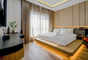 Suite Deluxe, balcon, vue sur la ville | Rideaux d’obscurcissement, système d’insonorisation