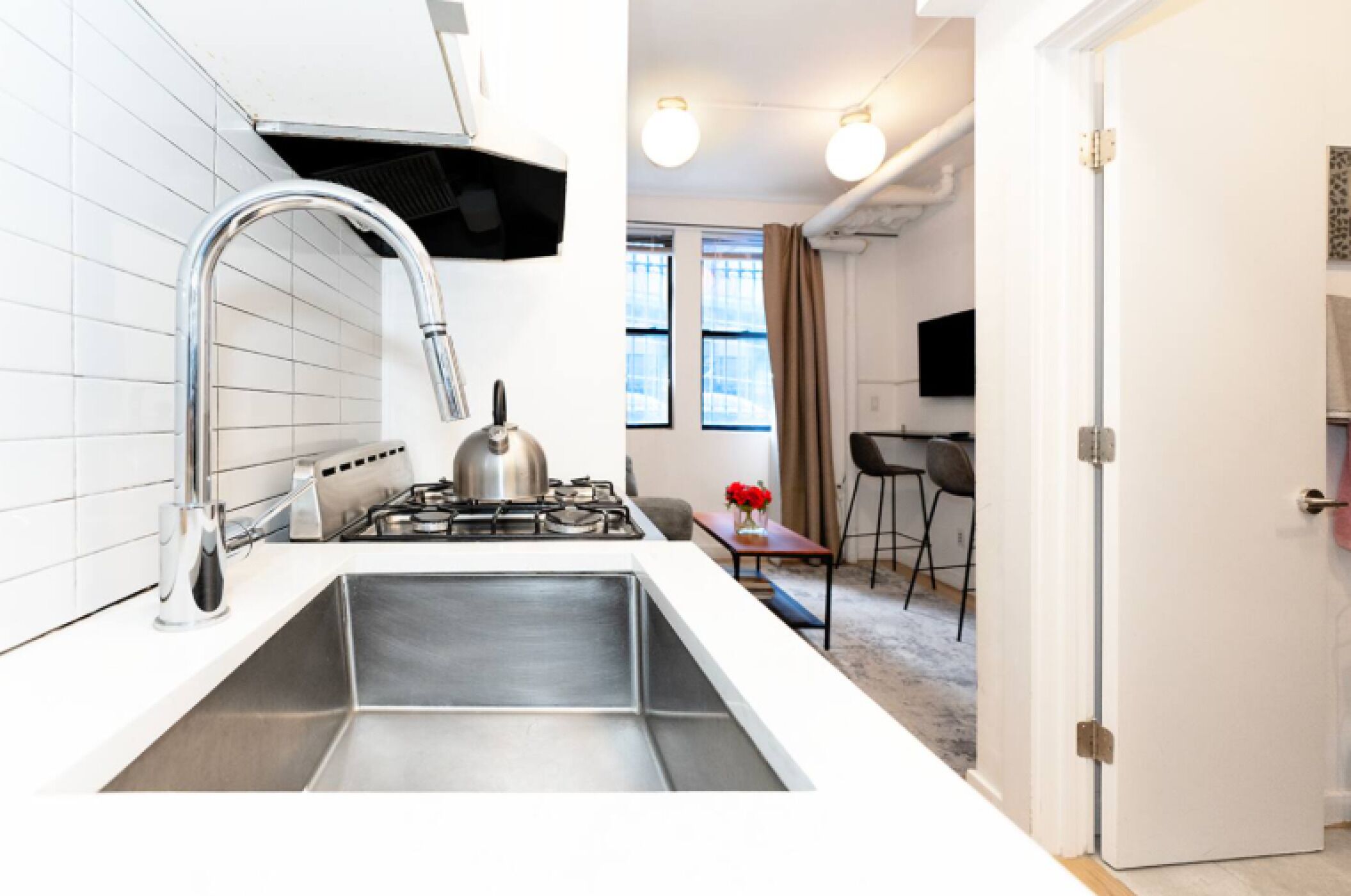 Fridge, stovetop, dishwasher, coffee/tea maker