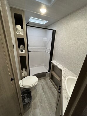 Shower, towels, soap, toilet paper - The Lake Escape RV Meets The Beach (Foley)