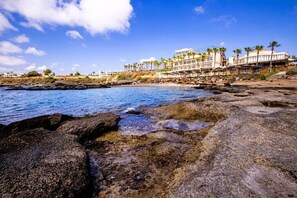 On the beach, sun loungers, beach towels
