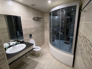 Studio Suite, City View | Bathroom | Combined shower/tub, hair dryer, towels, soap - Sunset hotel (Wadi Musa)