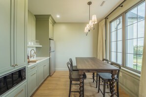 2-Bedroom Suite | 1 King, 2 Twins, Kitchenette, Fireplace | Dining room - The Penrose Suites (Saint Marys)