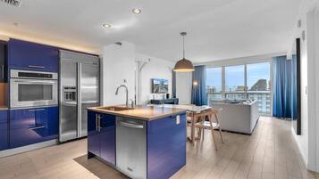 Luxury Apartment, Balcony, Lake View | Private kitchen | Coffee/tea maker, dining tables