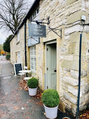 A stone building with a sign for 'Alseford Tea Room' and a chalkboard menu outside. - The Bakewell Retreat - Hot tub - Pets - Sleeps 9 (Bakewell)