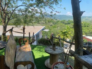 Sit and enjoy the serene views of the surrounding hills from this garden patio.