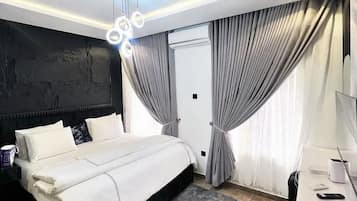Deluxe Room, Balcony, City View | Desk, laptop workspace, free WiFi