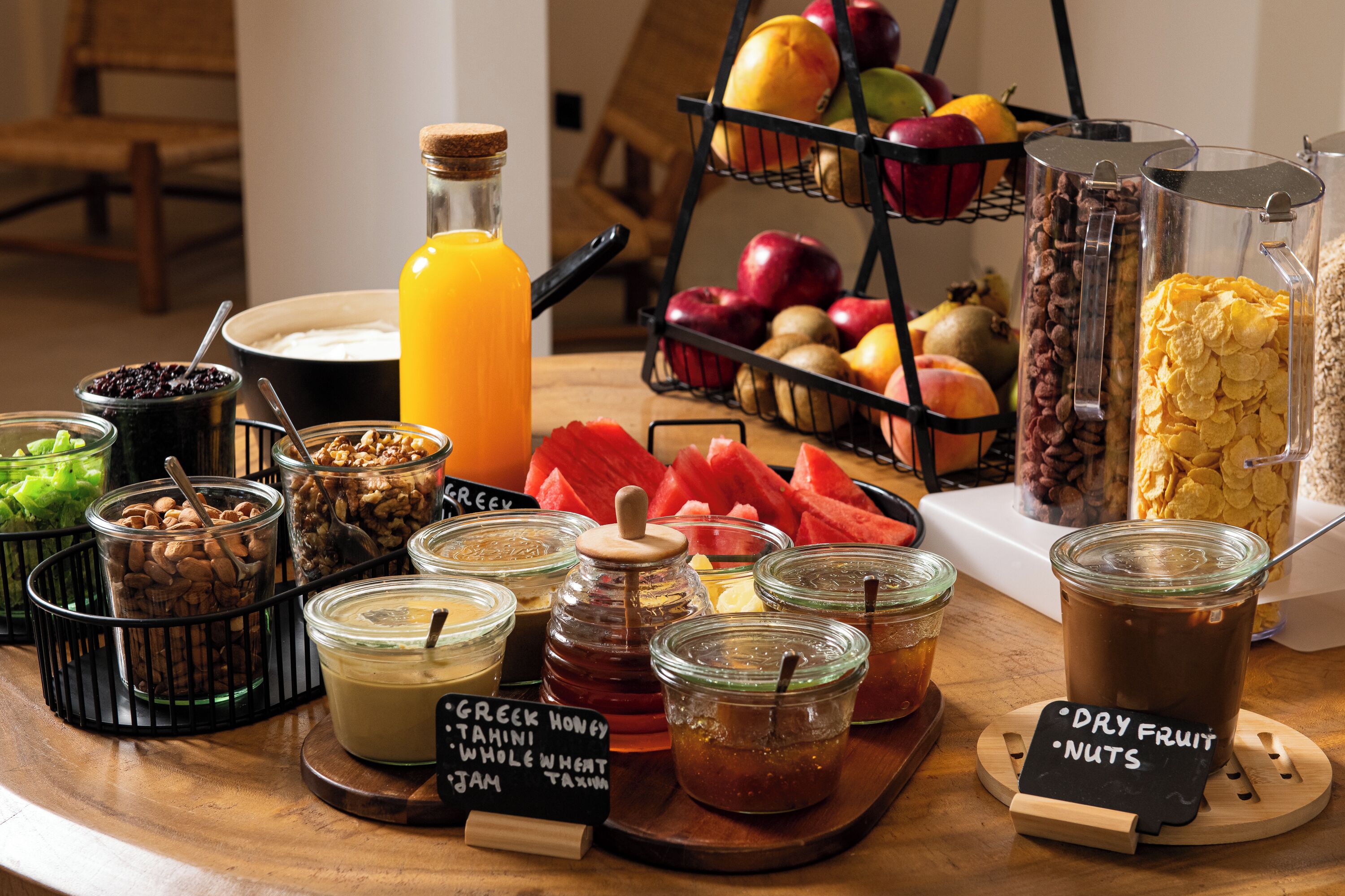 A breakfast buffet with various food items and beverages.