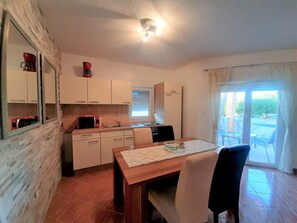 Fridge, microwave, stovetop, coffee/tea maker