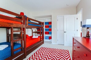 A bunk bed room with a red and white chevron rug, a white door, and a red dresser. - Red White & WTG: Hot Tub, 5 Bedrooms! (Wintergreen Resort)