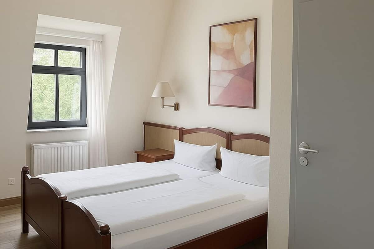 Premium bedding, desk, laptop workspace, free WiFi