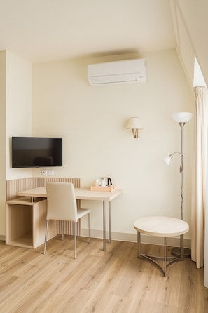 Premium bedding, desk, laptop workspace, free WiFi