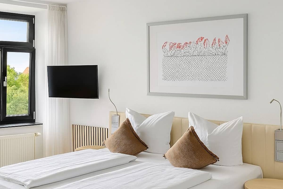 Premium bedding, desk, laptop workspace, free WiFi