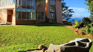 A modern two-story building with large windows and a flat roof. - Mount Hunt Resort (Beragala)