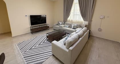 Spacious 4-bedroom apartment with WiFi, AC in terrific Shakhbout City