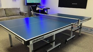 A table tennis table with a net, branded with 'DONIC' and 'WALDNER CLASSIC 25'. - SkiBoltonValleyVTPresWkFeb12-19Slopeside1bdrm2bthSteSlps8 (Richmond)
