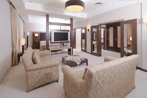 President Suite | Living area | 32-inch flat-screen TV with satellite channels