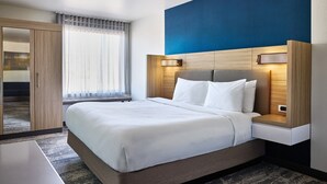 A hotel room with a bed, bedside tables, a wardrobe, and a window with curtains. - SpringHill Suites by Marriott St. Louis Chesterfield (Chesterfield)