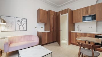 Superior Apartment | Living area | Flat-screen TV