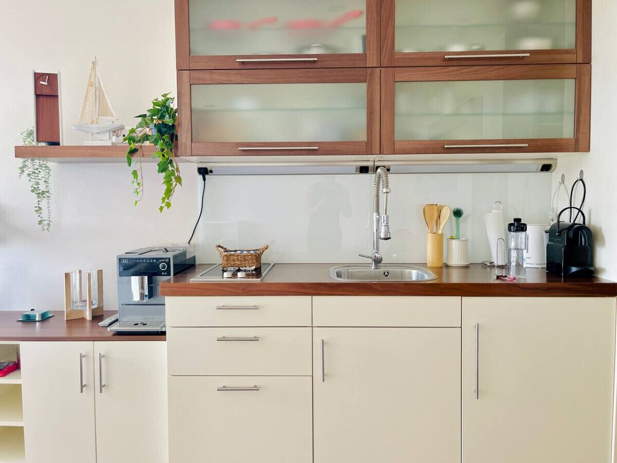 Fridge, stovetop, dishwasher, coffee/tea maker