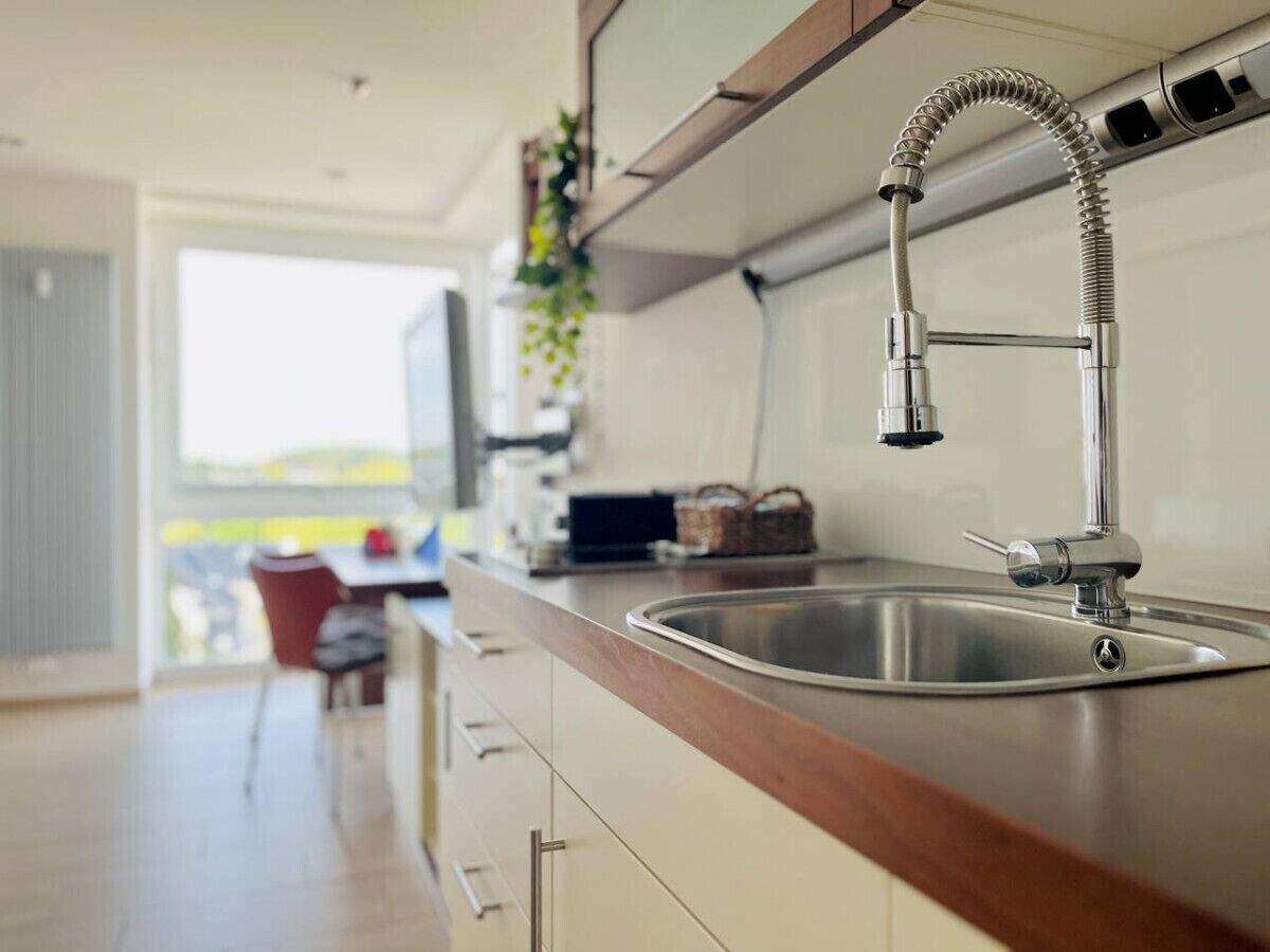 Fridge, stovetop, dishwasher, coffee/tea maker