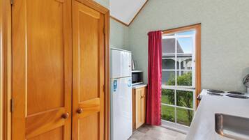 Fridge, microwave, toaster, cookware/dishes/utensils