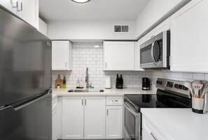Fridge, microwave, stovetop, coffee/tea maker