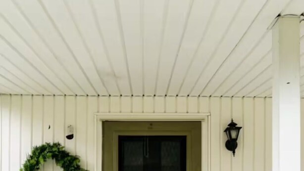 A white wooden porch with a green door, a white railing, and a wreath on the wall. - Private Home Near I71, Snow Trails, Golf & Race Tracks (Mansfield)