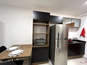 Fridge, microwave, stovetop, cookware/dishes/utensils