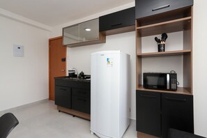 Fridge, microwave, stovetop, cookware/dishes/utensils