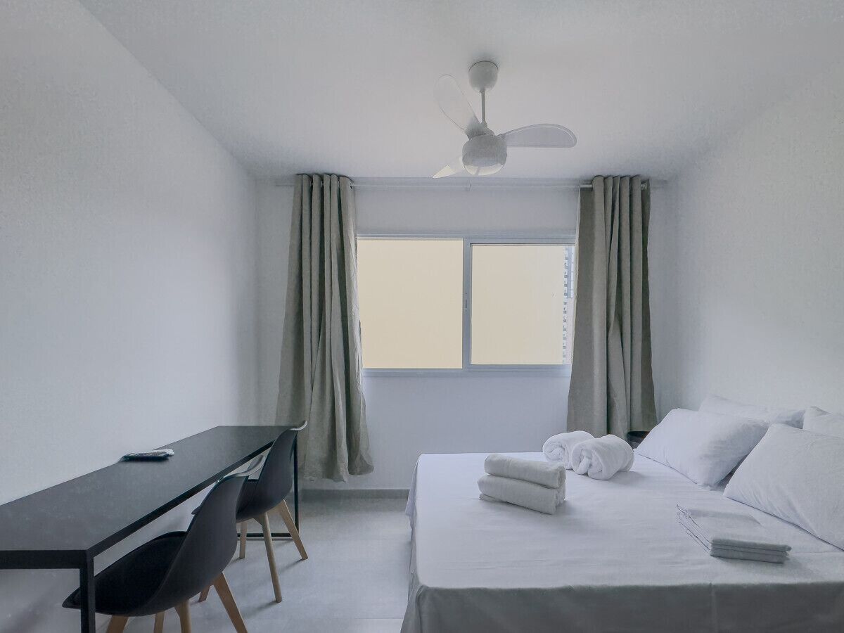 1 bedroom, desk, bed sheets