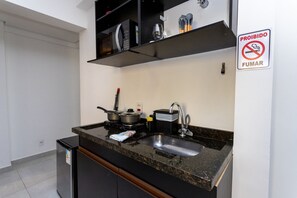 Fridge, microwave, stovetop, coffee/tea maker