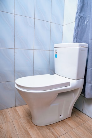Shower, free toiletries, slippers, towels