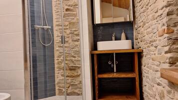 Bidet, towels, soap, toilet paper