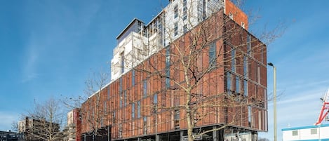 A modern building with a brick facade and large windows.