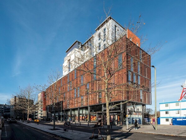A modern building with a brick facade and large windows.