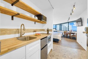 Fridge, microwave, stovetop, coffee/tea maker