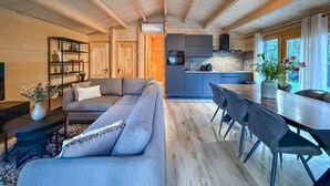 A modern log cabin interior with a living area, dining space, and kitchen. - Gorgeous home in Meijel with WiFi (Meijel)