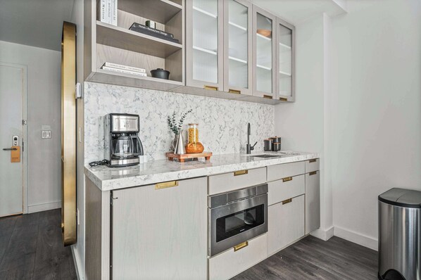 Fridge, microwave, coffee/tea maker, toaster