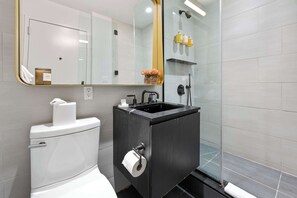 Shower, hair dryer, towels, shampoo