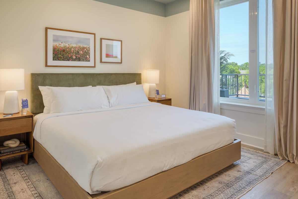 Suite, 1 King Bed with Sofa bed, Balcony | 2 bedrooms, premium bedding, laptop workspace, blackout drapes